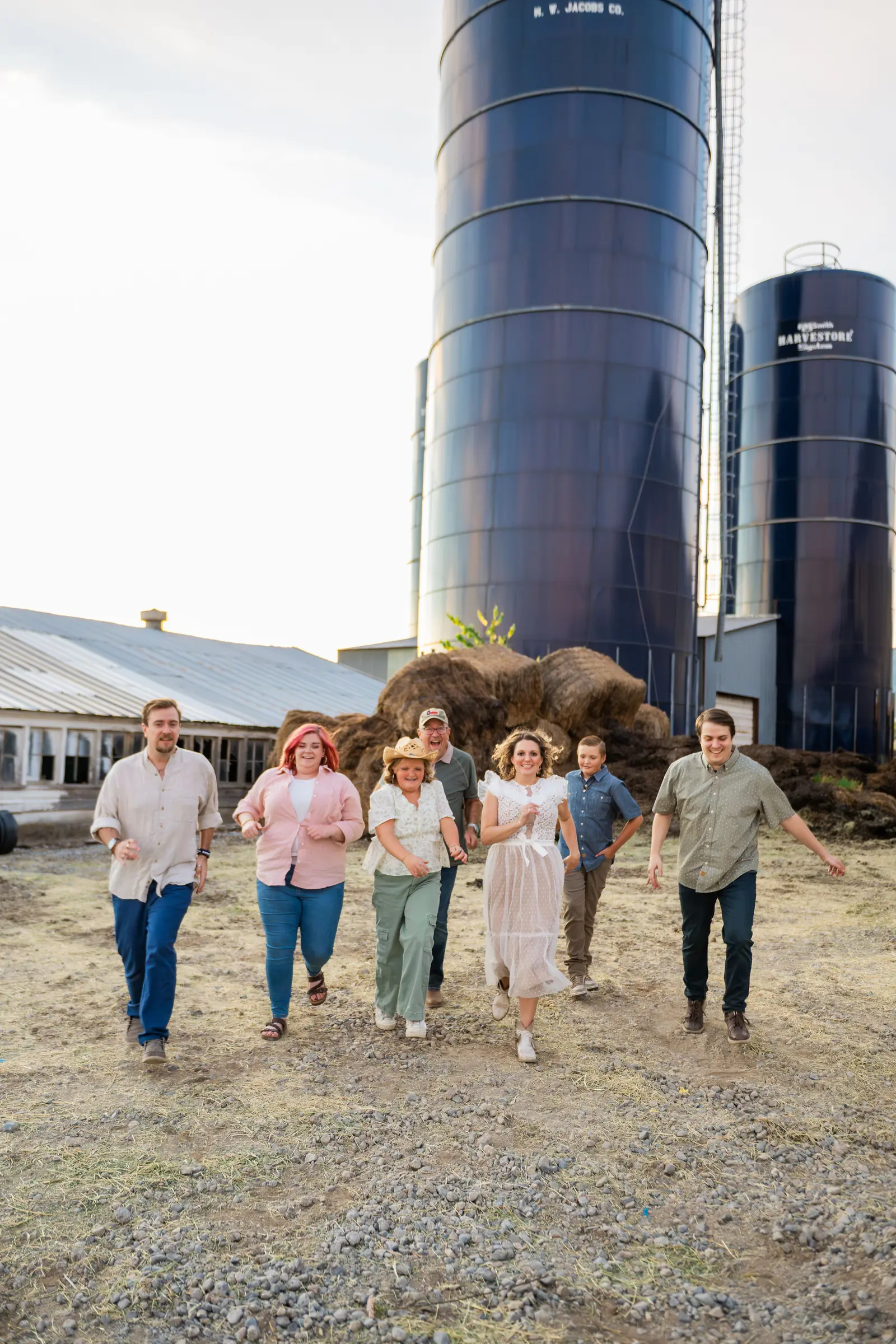 The family running past the silos
